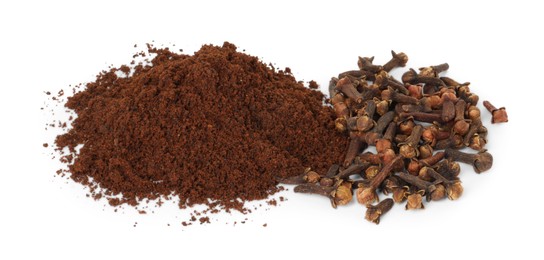 Photo of Pile of clove powder and dried buds on white background. Aromatic spice