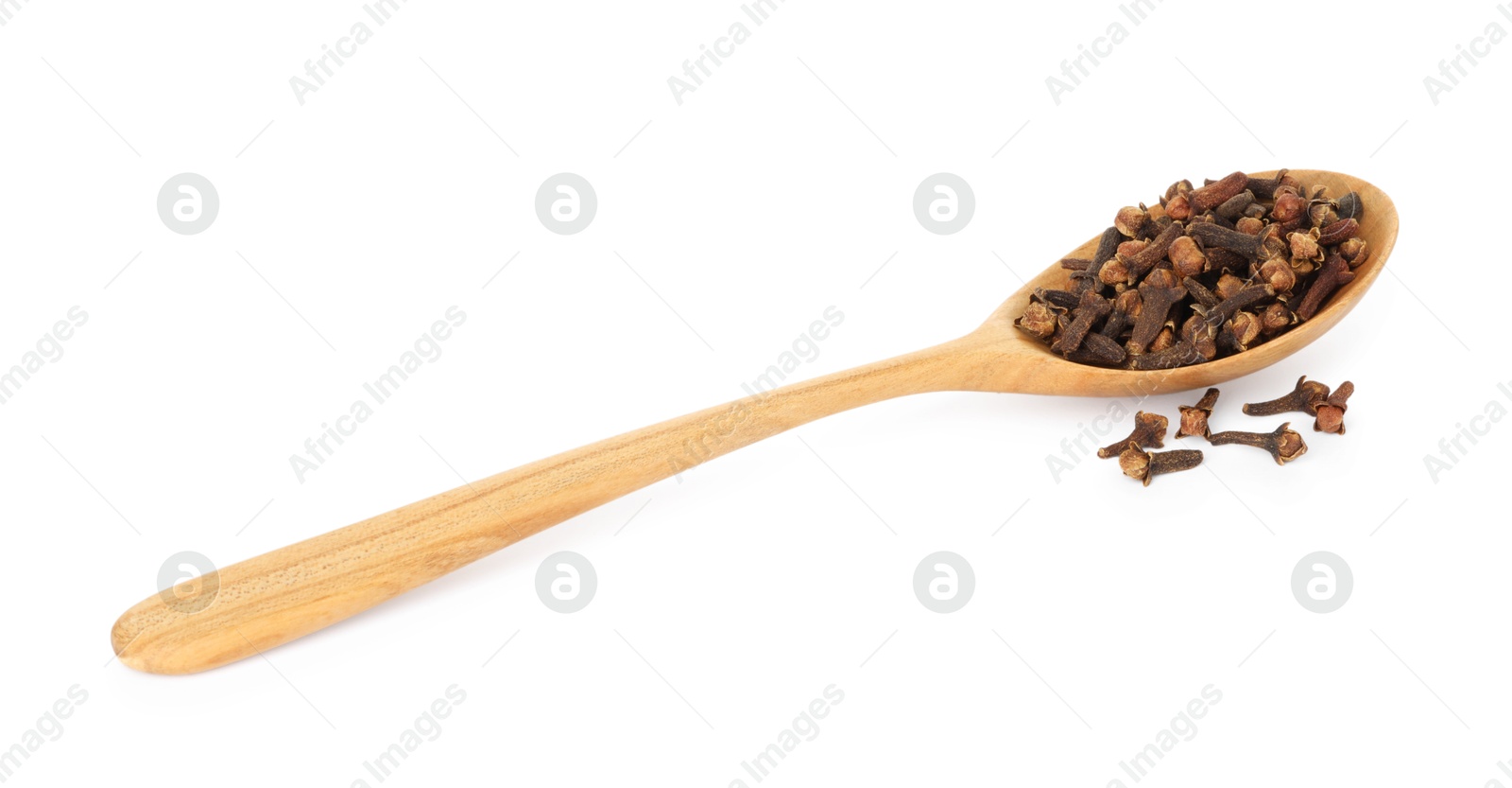 Photo of Dry clove buds in wooden spoon on white background. Aromatic spice