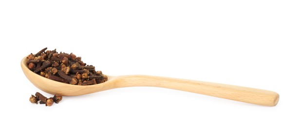 Dry clove buds in wooden spoon on white background. Aromatic spice