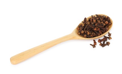 Photo of Dry clove buds in wooden spoon on white background. Aromatic spice