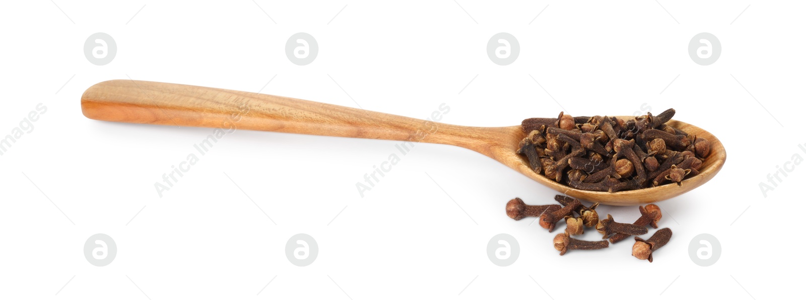 Photo of Dry clove buds in wooden spoon on white background. Aromatic spice