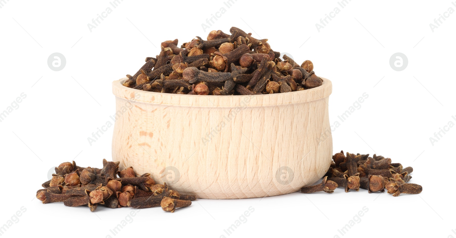 Photo of Dry clove buds in wooden bowl on white background. Aromatic spice