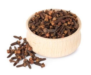 Photo of Dry clove buds in wooden bowl on white background. Aromatic spice