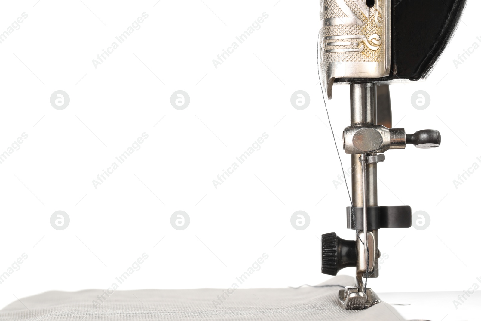 Photo of Sewing machine with grey fabric isolated on white