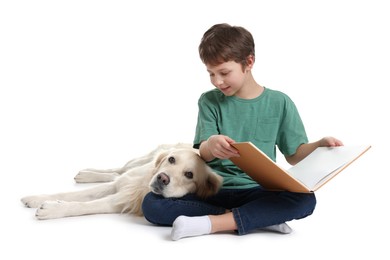 Photo of Boy reading book with his cute dog on white background