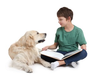 Boy reading book with his cute dog on white background