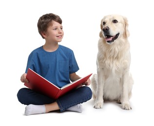 Photo of Boy reading book with his cute dog on white background