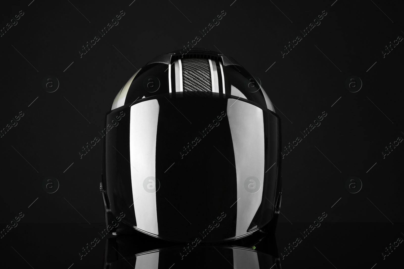 Photo of Motorcycle helmet with visor on black background