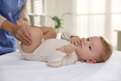 Pediatrician with little child in clinic, closeup. Checking baby's health