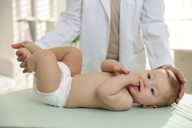 Pediatrician with little child in clinic, closeup. Checking baby's health