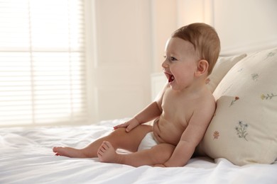 Photo of Cute little baby on bed at home