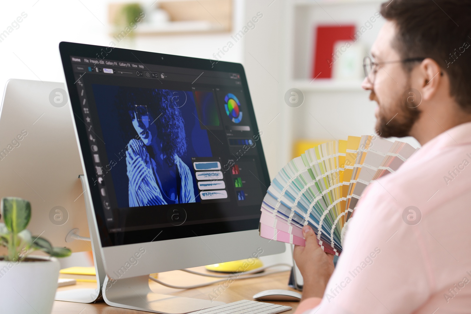 Photo of Designer working at table in modern office