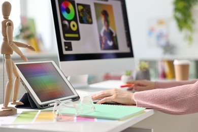 Photo of Designer working at table in office, closeup