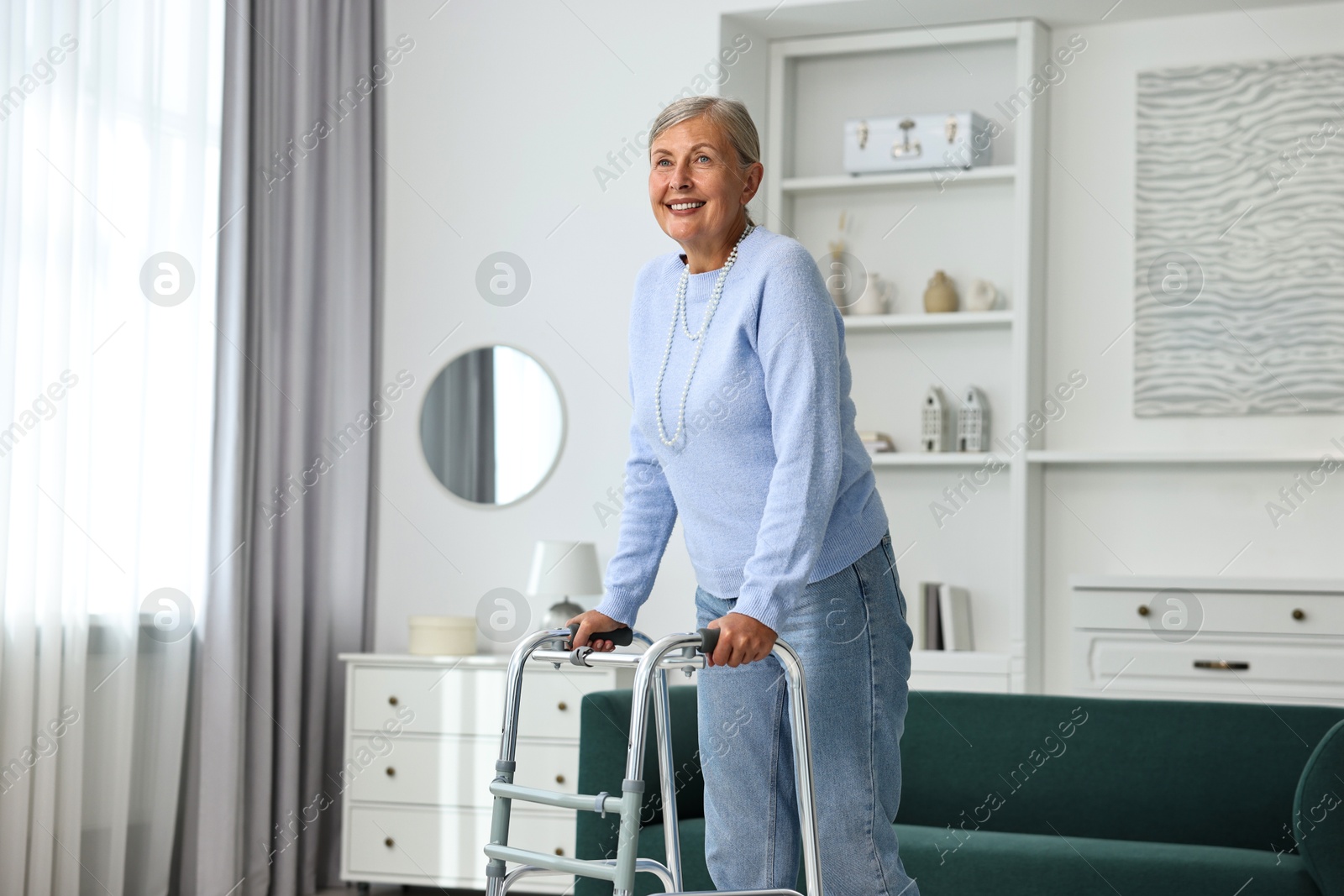 Photo of Senior woman with walking frame at home