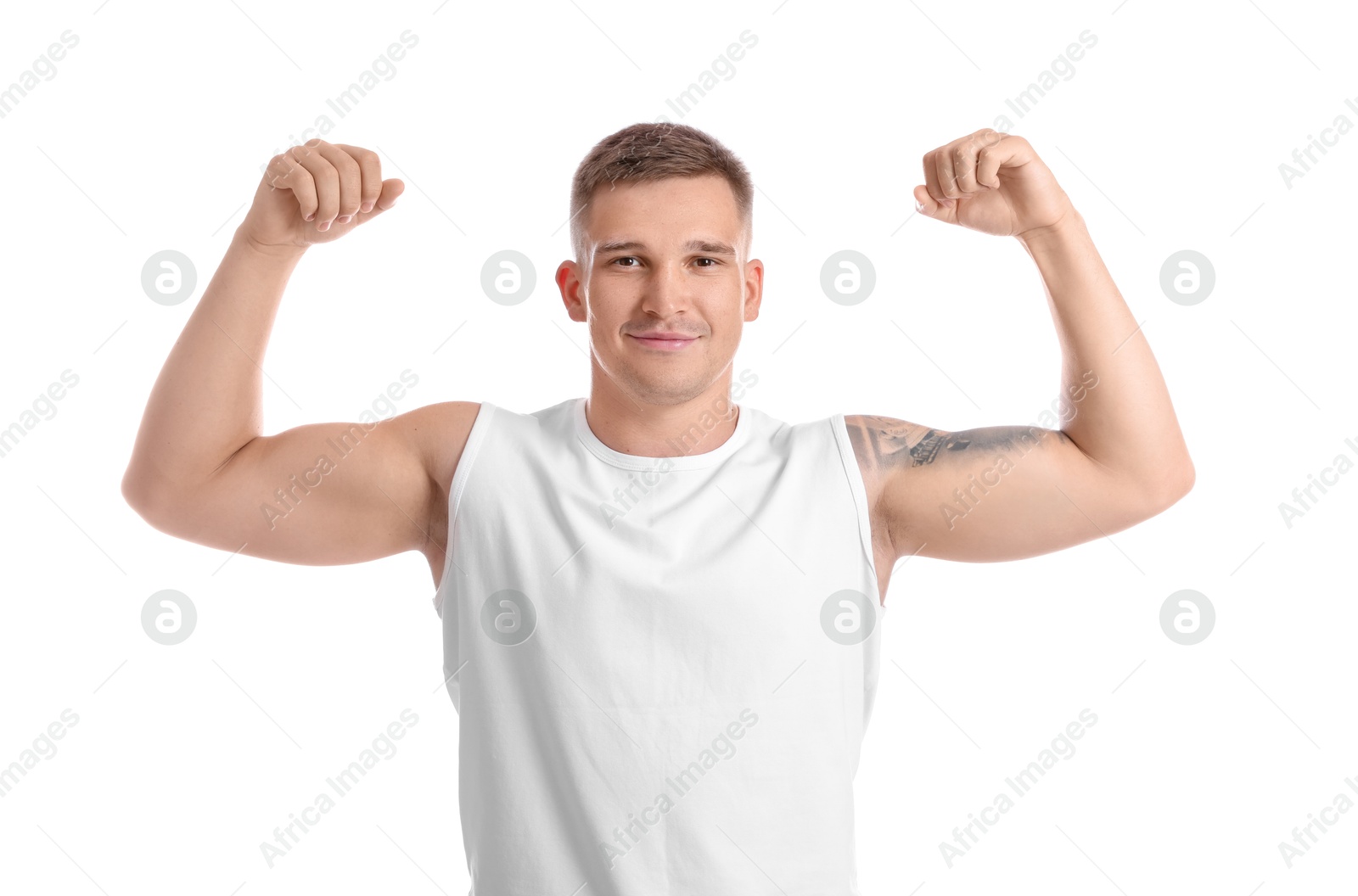 Photo of Smiling winner showing his biceps on white background