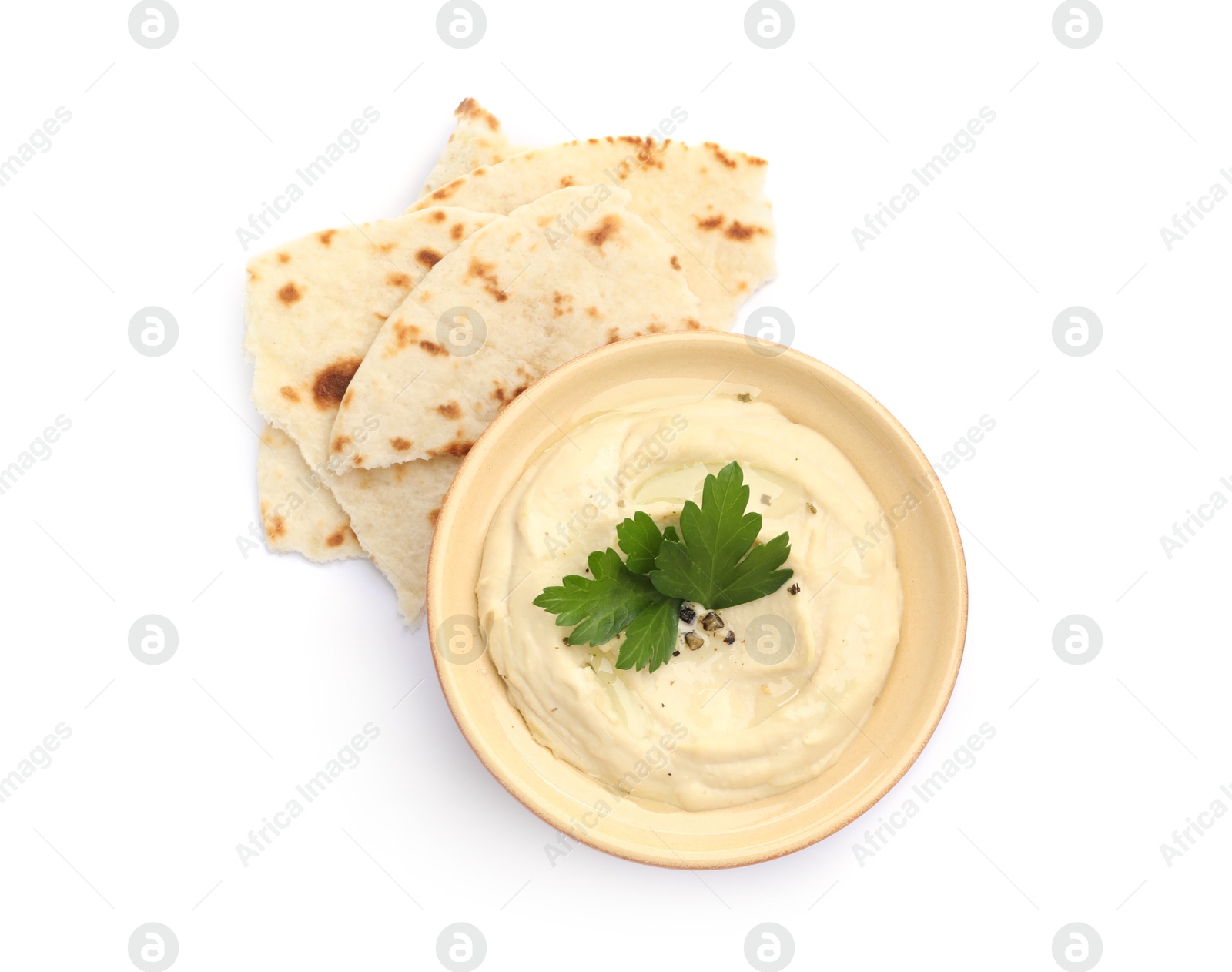 Photo of Delicious hummus with parsley and pita isolated on white, top view