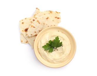 Photo of Delicious hummus with parsley and pita isolated on white, top view