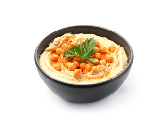 Photo of Delicious hummus with parsley, paprika and chickpeas in bowl isolated on white