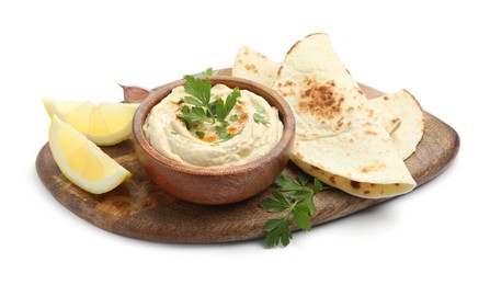 Photo of Delicious hummus with parsley, paprika, pita and lemon isolated on white