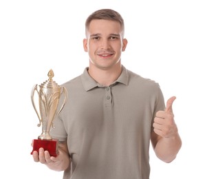 Photo of Happy winner with golden trophy cup showing thumbs up on white background