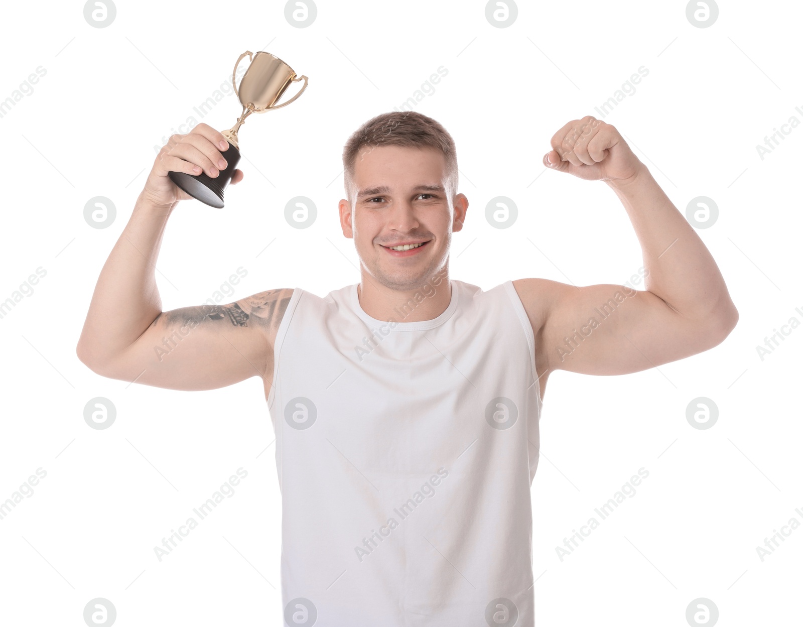 Photo of Happy winner with golden trophy cup showing his biceps on white background