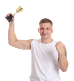 Photo of Smiling winner with golden trophy cup on white background