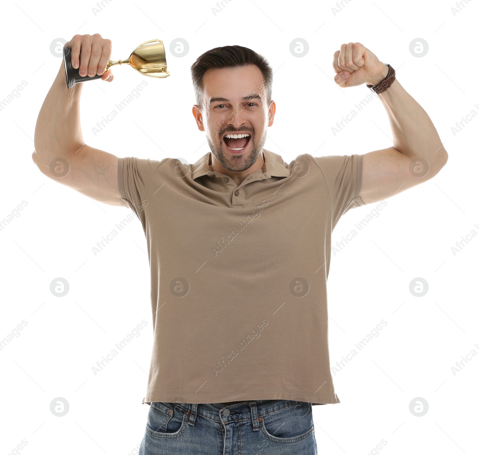 Photo of Happy winner with golden trophy cup showing his biceps on white background