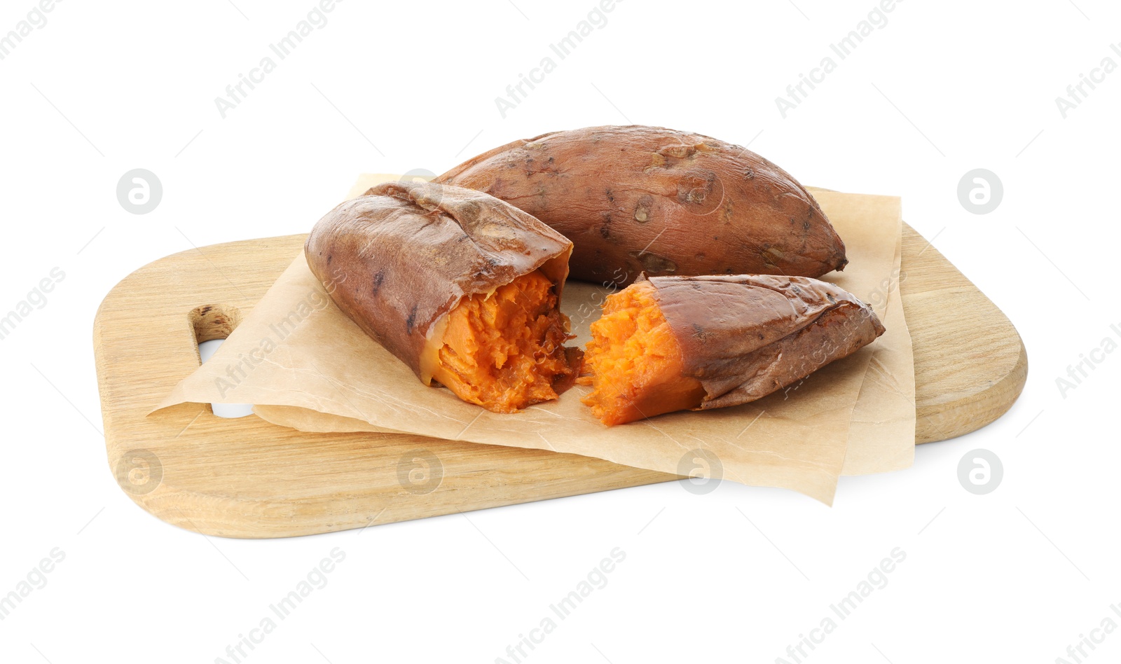 Photo of Tasty cooked sweet potatoes and wooden board isolated on white