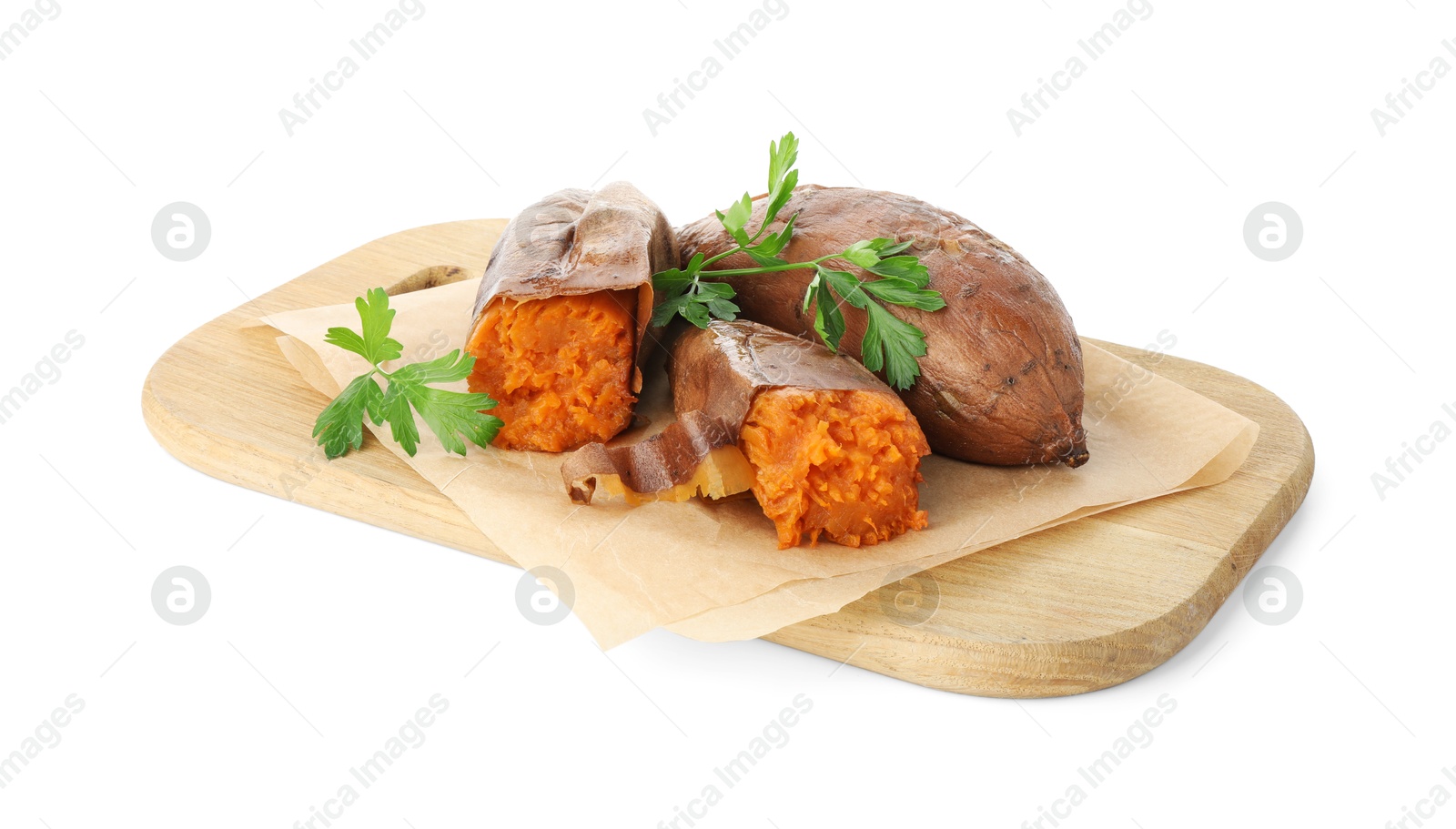 Photo of Tasty cooked sweet potatoes, parsley and wooden board isolated on white