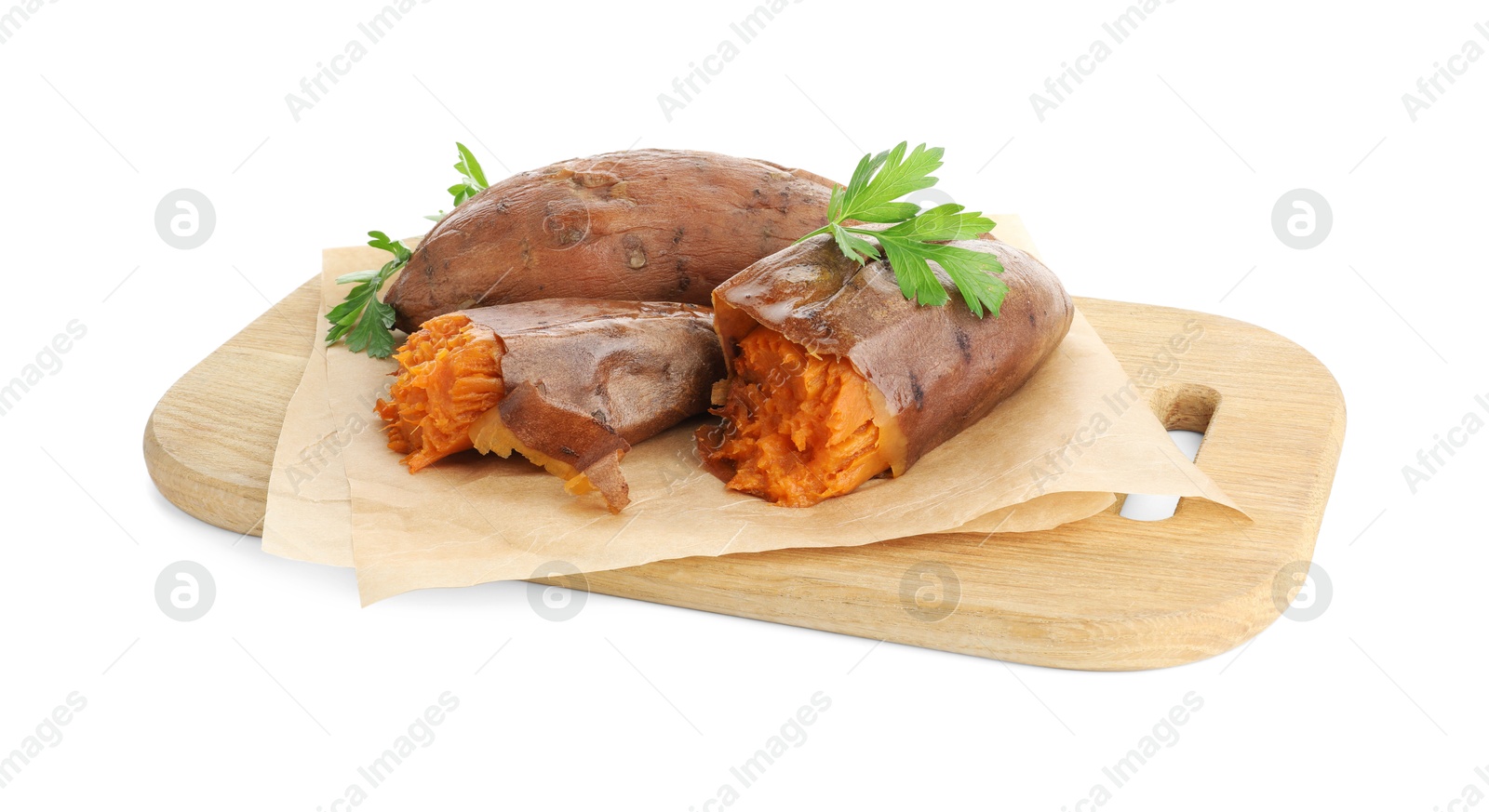 Photo of Tasty cooked sweet potatoes, parsley and wooden board isolated on white