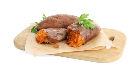 Tasty cooked sweet potatoes, parsley and wooden board isolated on white