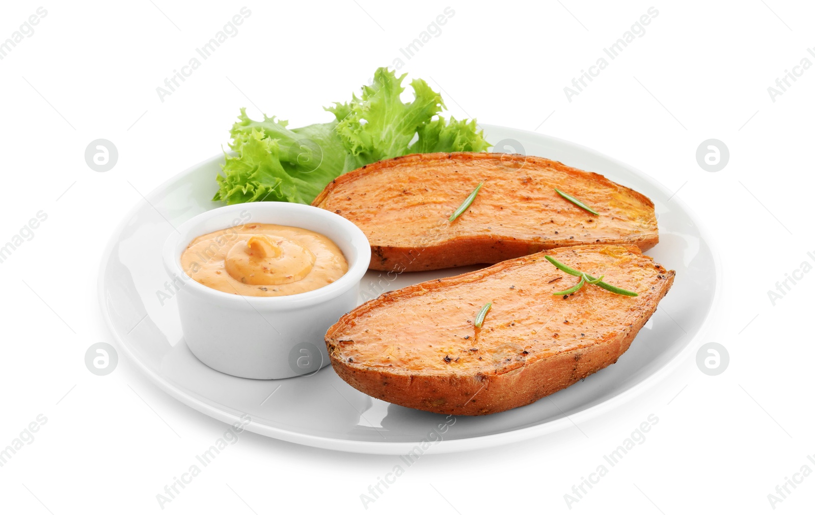 Photo of Halves of tasty cooked sweet potato with rosemary, lettuce and sauce isolated on white