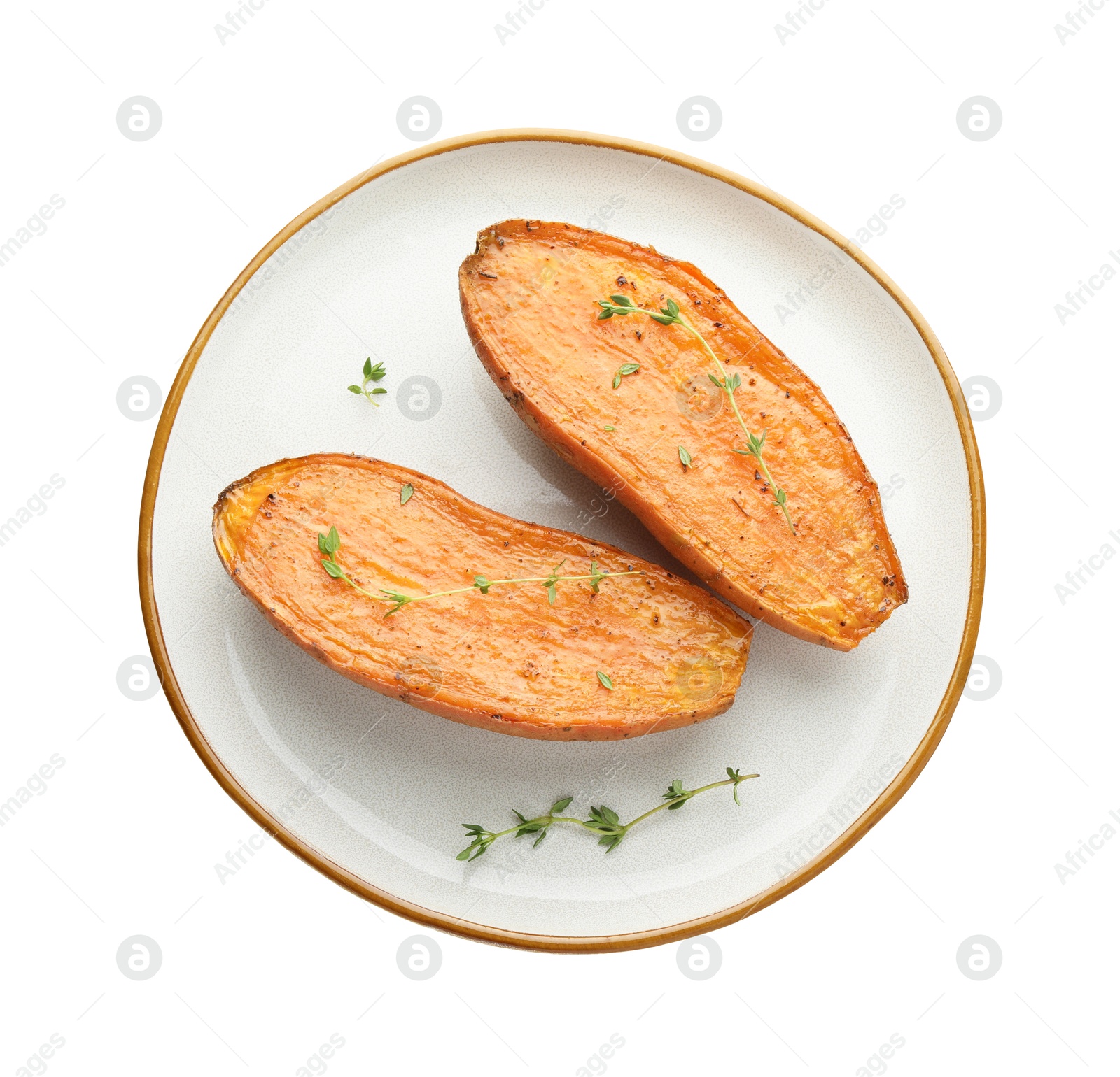 Photo of Halves of tasty cooked sweet potato with thyme isolated on white, top view