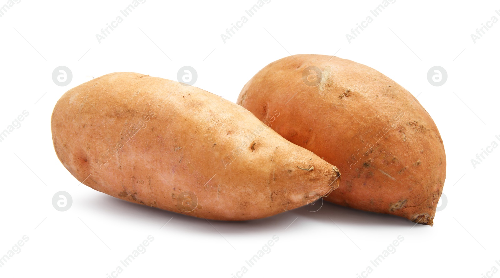 Photo of Fresh raw sweet potatoes isolated on white