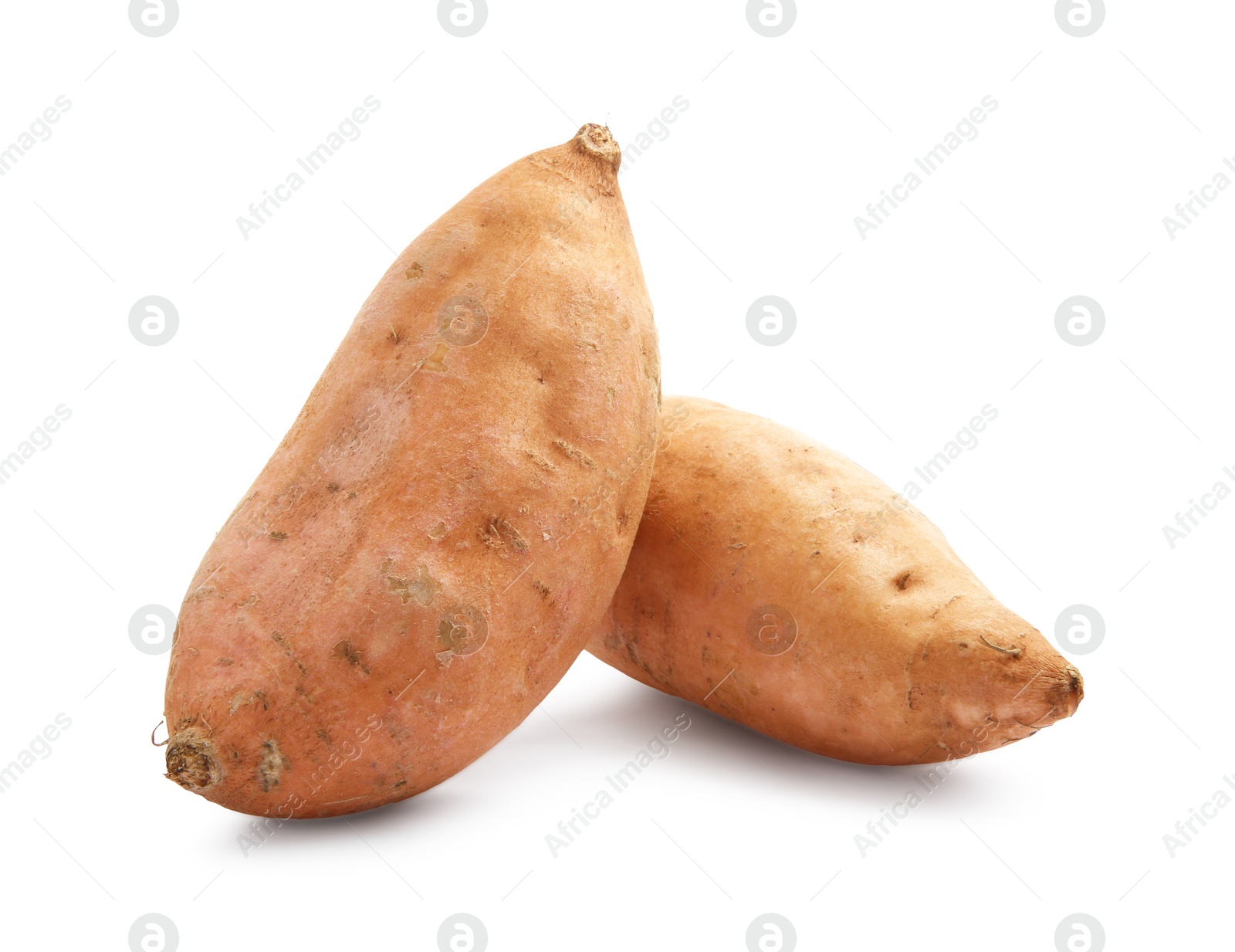 Photo of Fresh raw sweet potatoes isolated on white