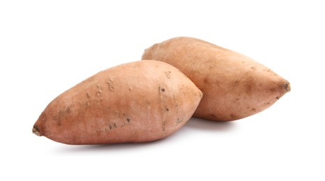 Photo of Fresh raw sweet potatoes isolated on white