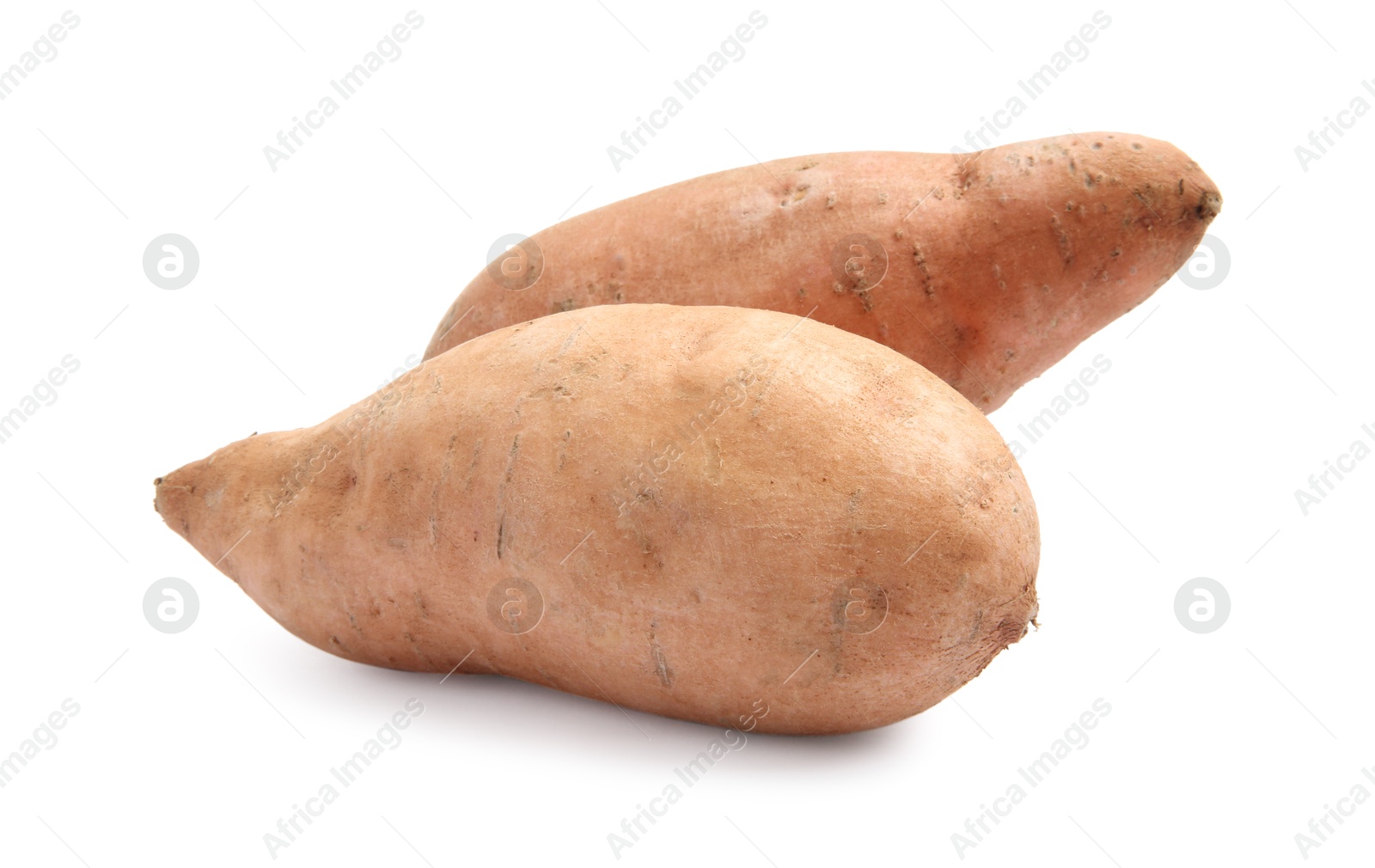 Photo of Fresh raw sweet potatoes isolated on white