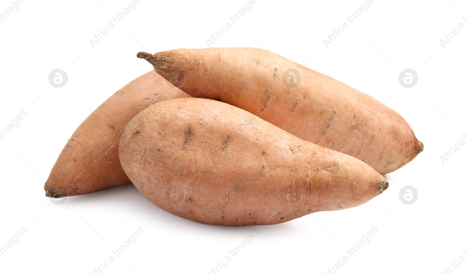 Photo of Fresh raw sweet potatoes isolated on white