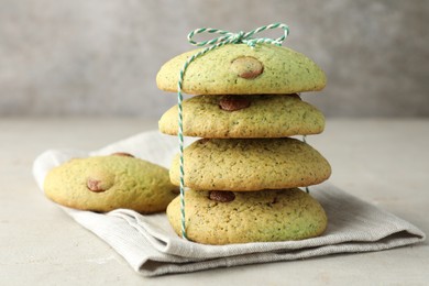 Photo of Delicious mint chocolate chip cookies on light table, closeup