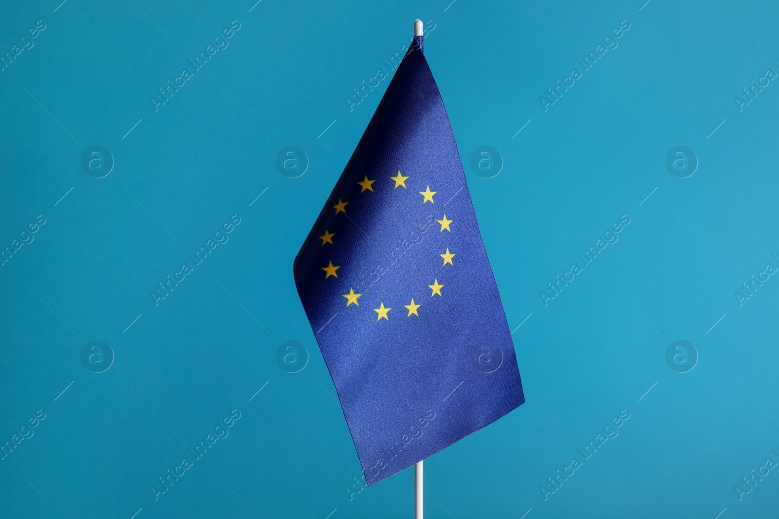 Photo of One flag of European Union on light blue background