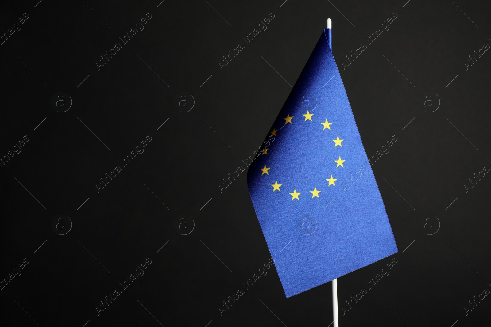 Photo of One flag of European Union on black background. Space for text