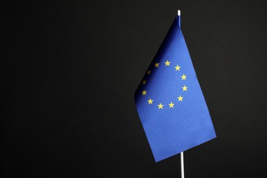 Photo of One flag of European Union on black background. Space for text