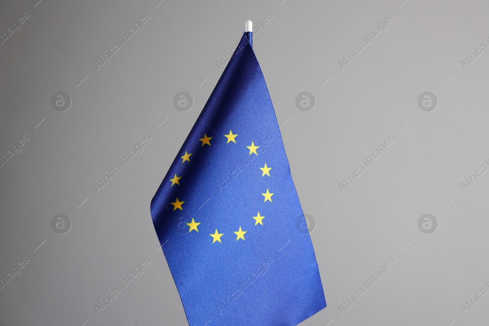 Photo of One flag of European Union on grey background