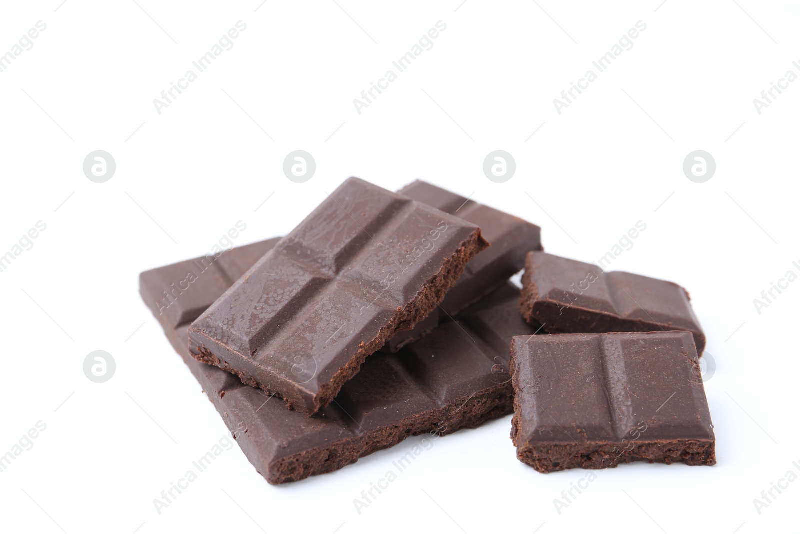 Photo of Pieces of delicious dark chocolate isolated on white