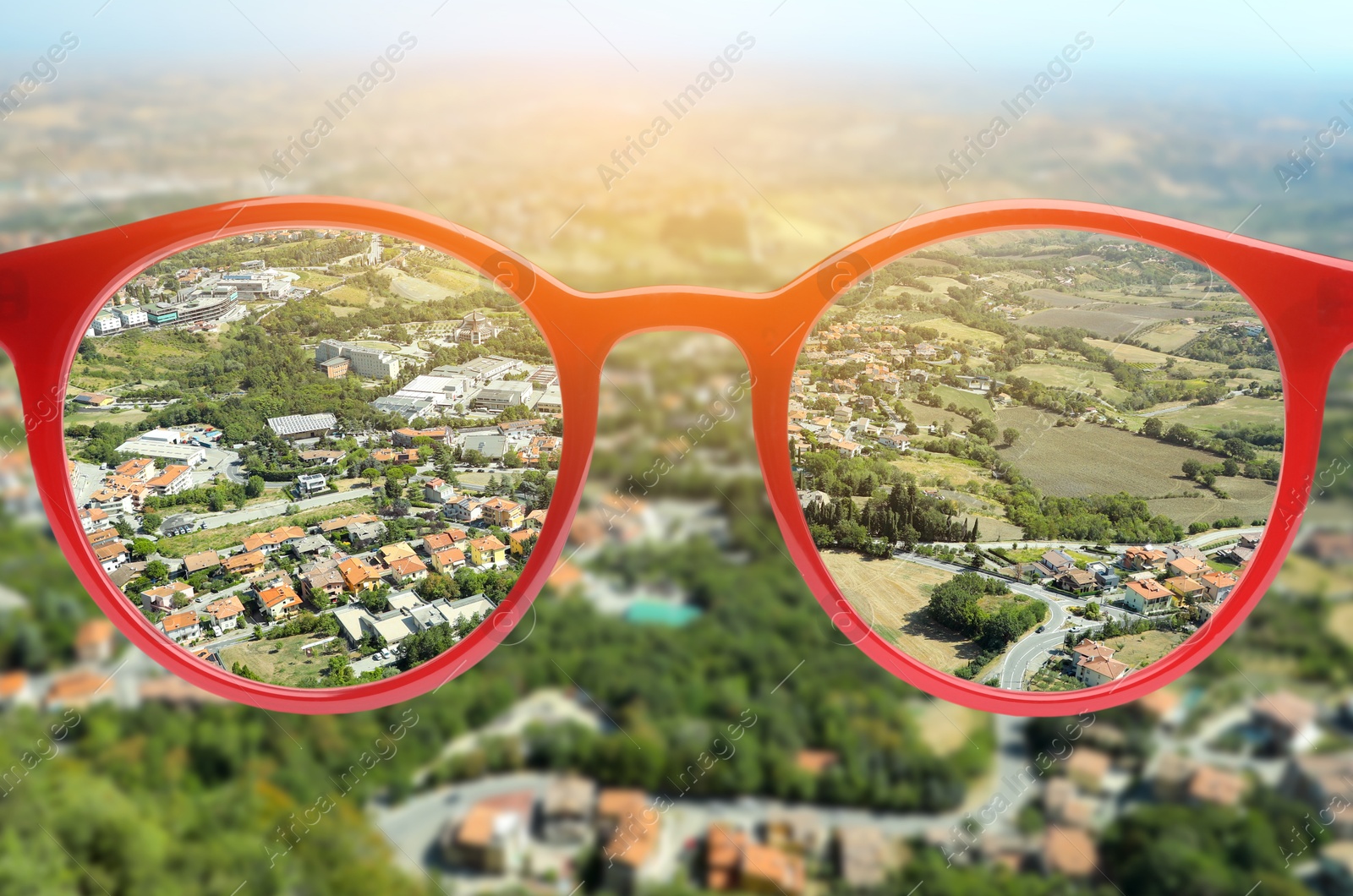 Image of Glasses against beautiful landscape. View through lenses more clear. Vision correction