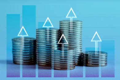 Image of Investment. Stacked coins with arrows and graph, toned in blue