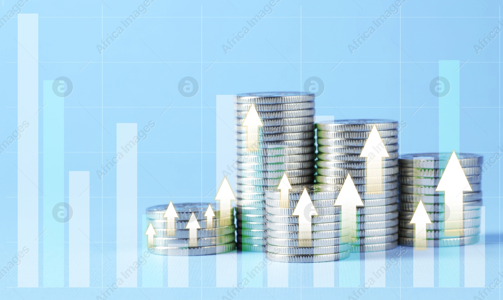 Image of Investment. Stacked coins with arrows and graph on light blue background