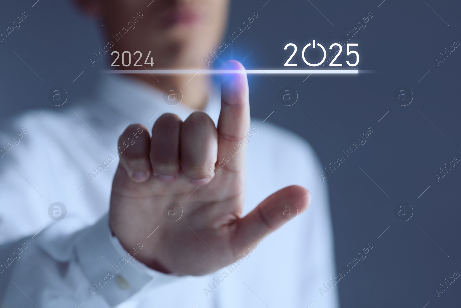 Image of New year goals. Businessman touching line leading from 2024 to 2025 on virtual screen against dark background, closeup