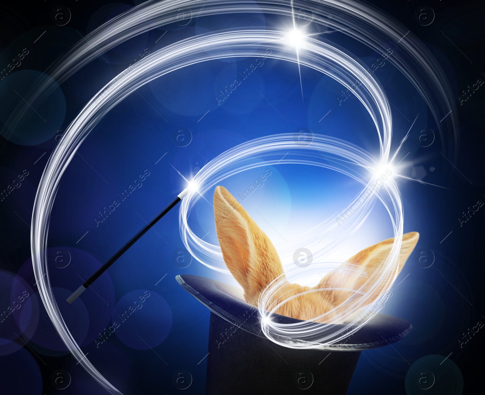 Image of Magic trick with wand. Bunny coming out of magician's hat on dark blue background