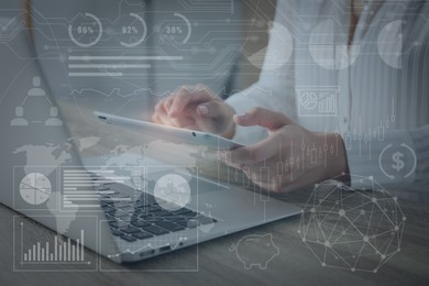 Technology and business. Woman working on tablet computer at table and graphs with schemes, double exposure